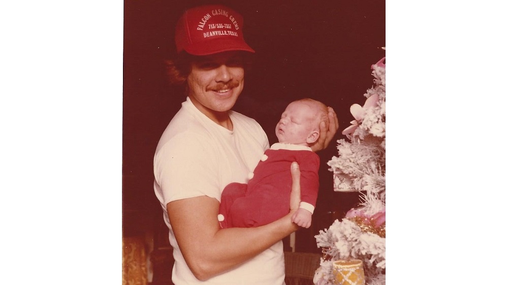 jason as a baby being held by his dad