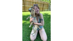emily hugging her friends dog
