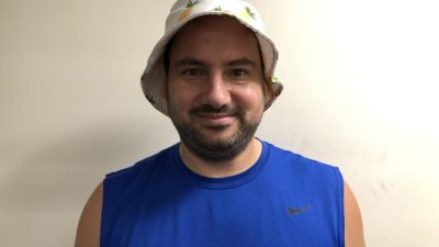 nick wearing a pineapple bucket hat