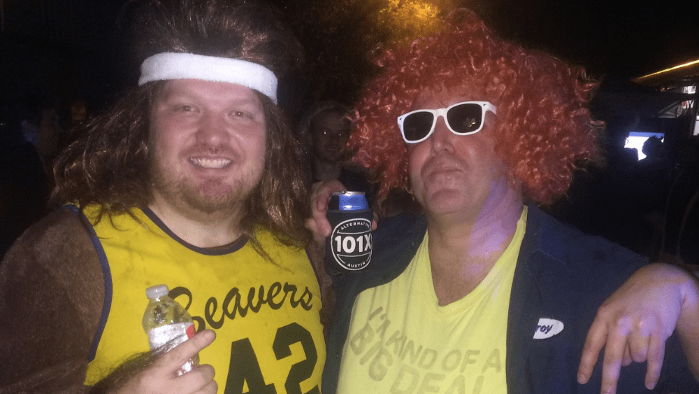 Jason dressed as teen wolf with a listener at a halloween party