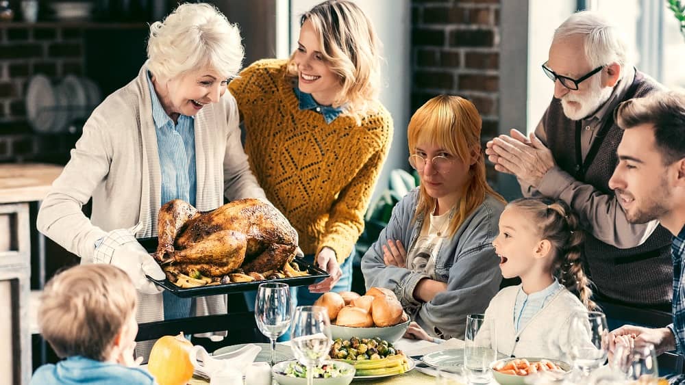 Emily photoshopped looking upset at a Thanksgiving meal with family