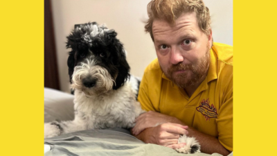 jason laying down next to his dog bogey