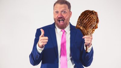 jason looking super excited with a tomahawk ribeye photoshopped into his hand