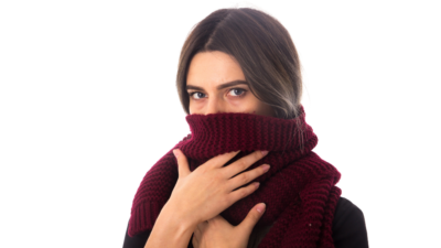 Woman hiding her neck with a scarf