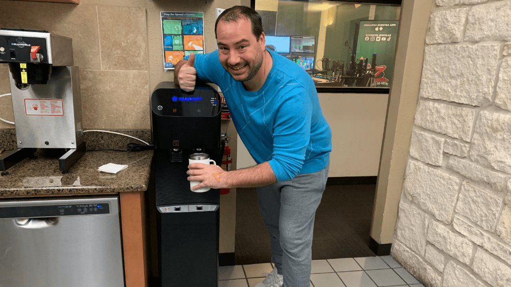 Nick next to our office's new water machine