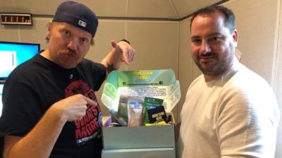 jason and nick holding a box of delta 8 gummies from hometown hero