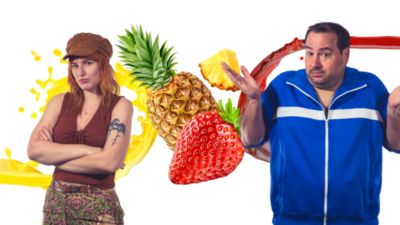 Emily and Nick standing behind a stock photo of a pineapple and a strawberry