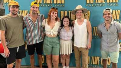 Emily and friends next to Big Time Rush