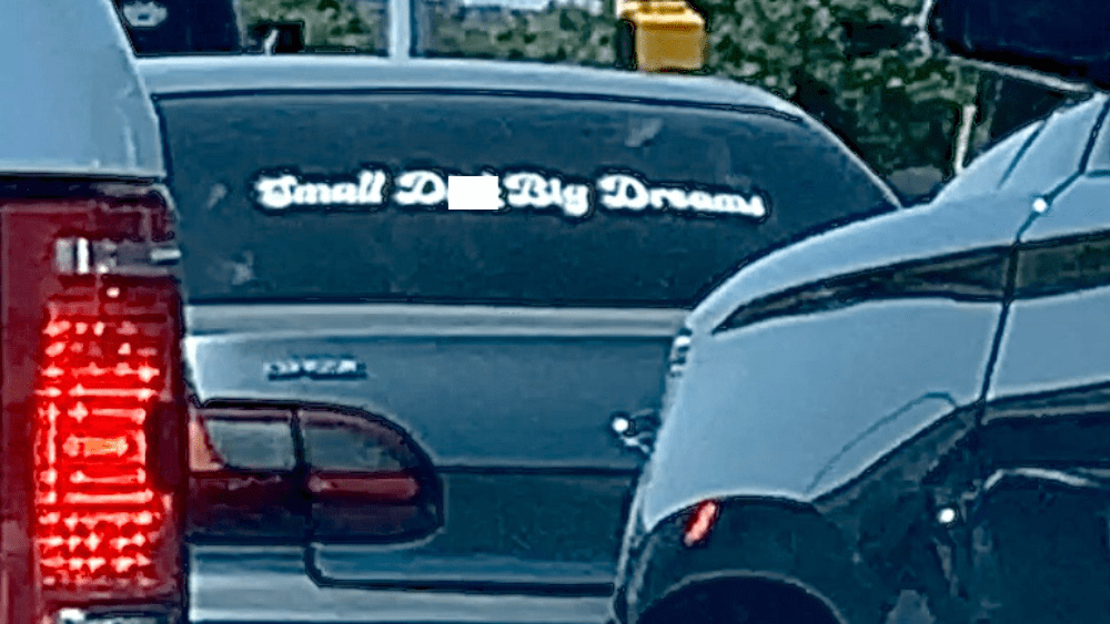 Car that says "Small d**k, Big dreams"