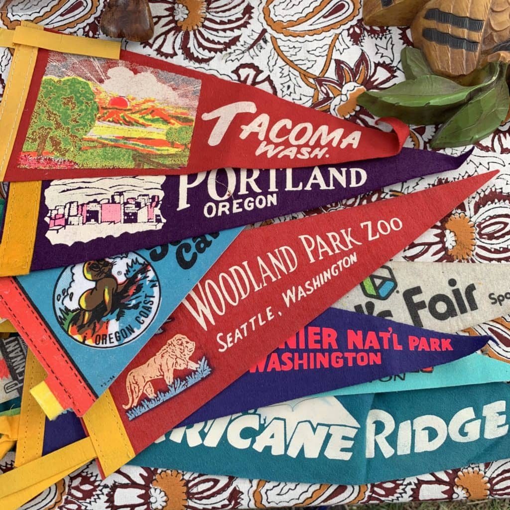 a picture of several colorful, vintage pennant flags. 