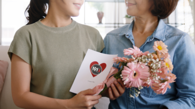Someone giving their mom a Mother's Day gift with a 101x logo on it