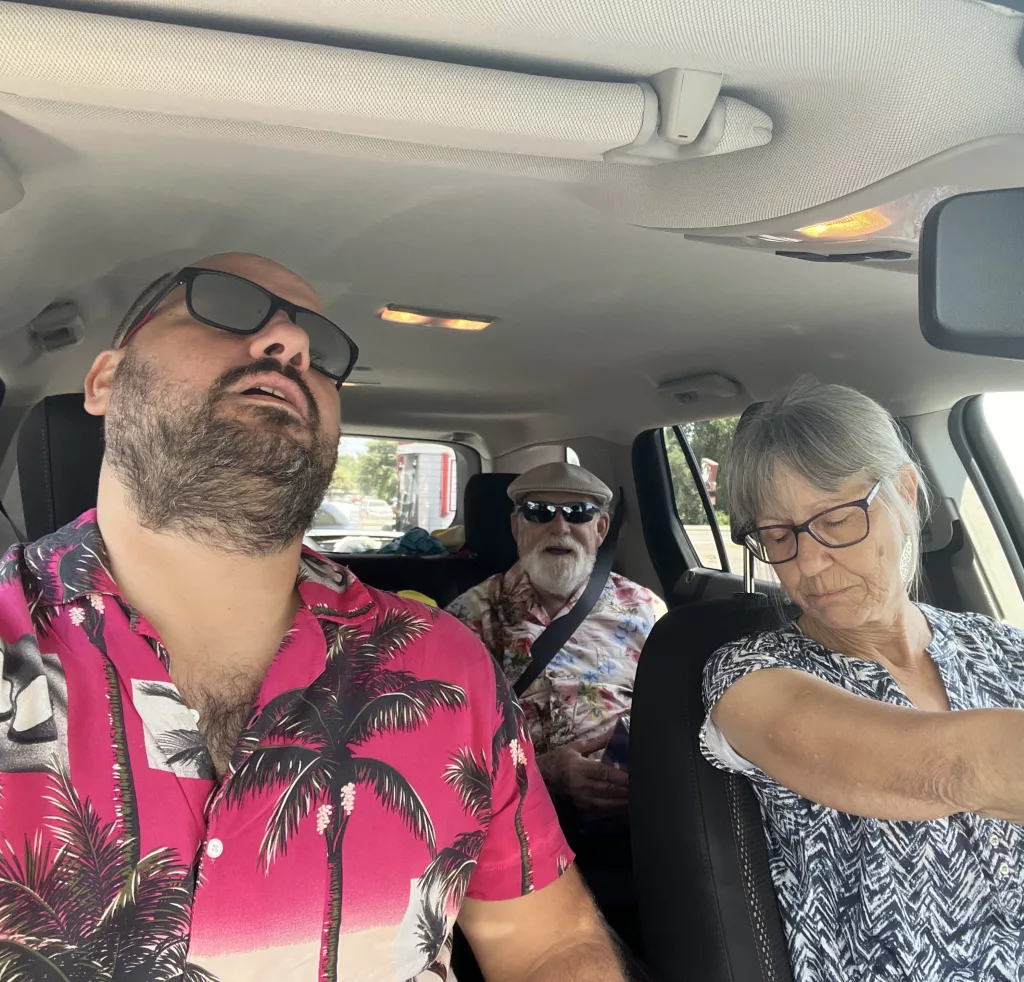 Nick and his parents in the car pretending like they are asleep