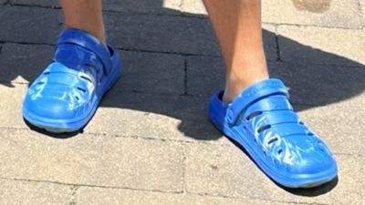 A picture of Nick wearing his off-brand crocs.