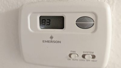 Emily's thermostat reading 83 degrees