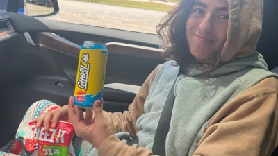 Bumblito holds a can of soda that reads, "Ghost" and "Swedish Fish."