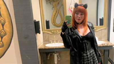 Emily wearing a black cat costume for Halloween last year