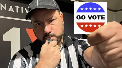 Nick dressed as a referee holding a go vote sticker