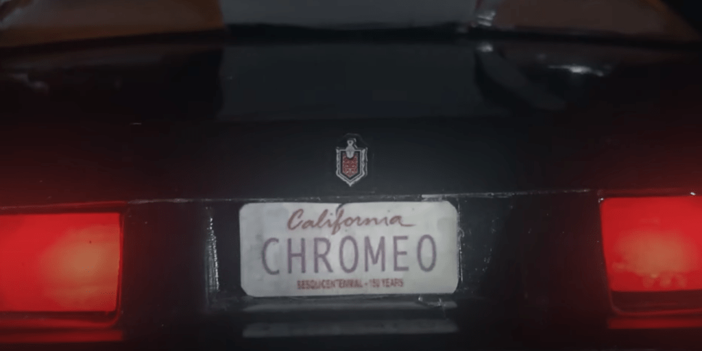 Screengrab from Music Video for Chromeo - Lost and Found, shows a car license pate with the tag reading "California - Chromeo"