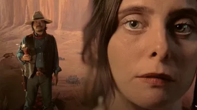 womans face with cowboy dressed man in background - grandaddy music video