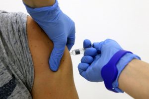Someone receiving a flu shot (Photo by Sergei FadeichevTASS via Getty Images)