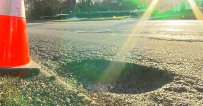 An image taken from WISH-TV of a pothole in the road.