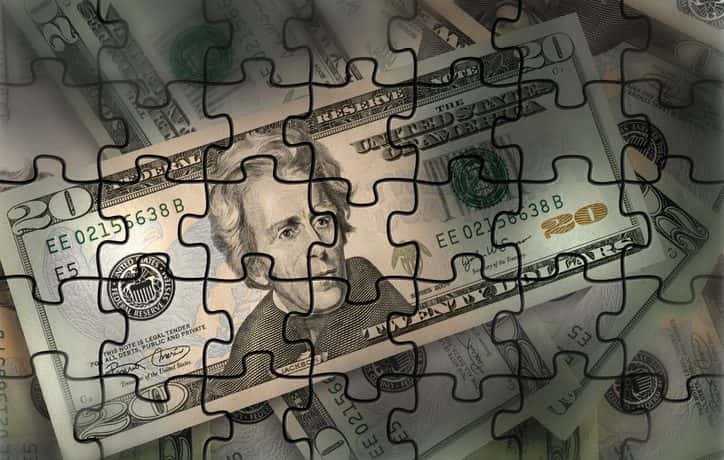 A completed puzzle showing a $20 American bill.