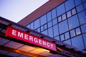 sign and awning at emergency room entrance (MJ Felt/Thinkstock)