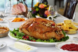 Turkey and other Thanksgiving food on a table.