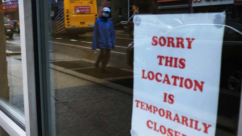 "Location is Temporarily Closed" sign posted in window of New York business