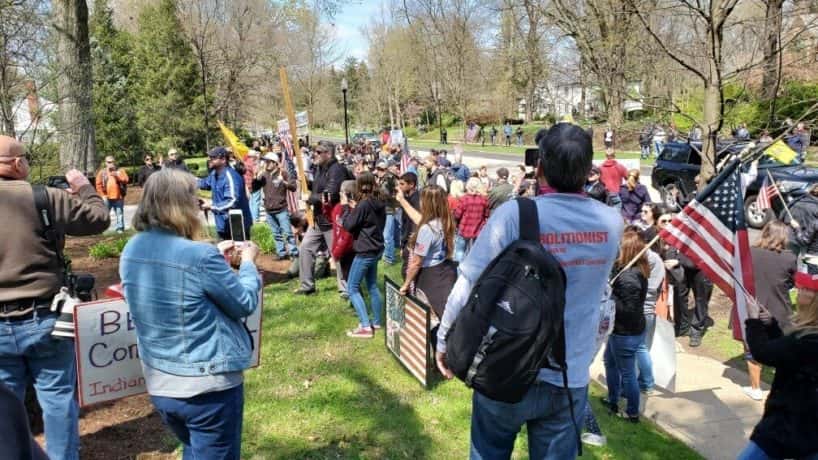 A group of protesters at Governor Holcomb's mansion Saturday