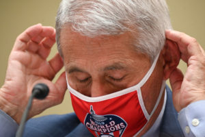 Anthony Fauci, director of the National Institute of Allergy and Infectious Diseases, wears a Washington Nationals protective mask during a House Select Subcommittee on the Coronavirus Crisis hearing on July 31, 2020 in Washington, DC. Trump administration officials are set to defend the federal government's response to the coronavirus crisis at the hearing hosted by a House panel calling for a national plan to contain the virus. (Photo by Erin Scott-Pool/Getty Images)
