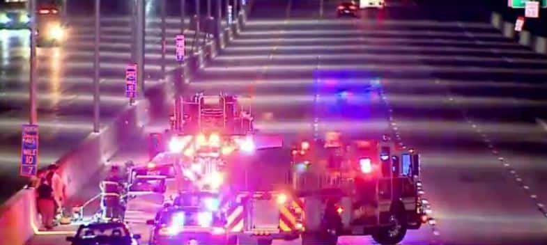 Firetrucks, police cars, and ambulances on the scene of the crash on I-465 near Sam Jones Expressway