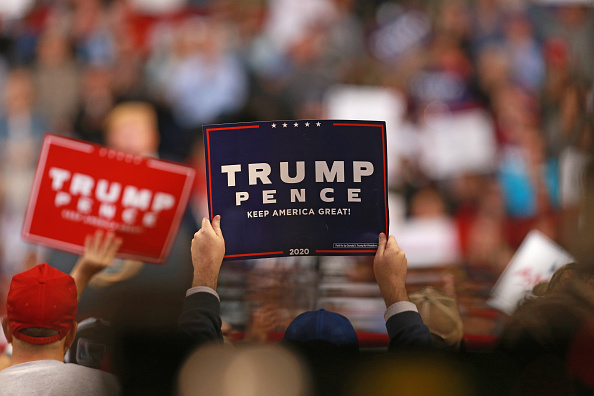 Attendees hold up signs as U.S. President Donald Trump speaks during a rally at CenturyLink Center on November 14, 2019 in Bossier City, Louisiana.