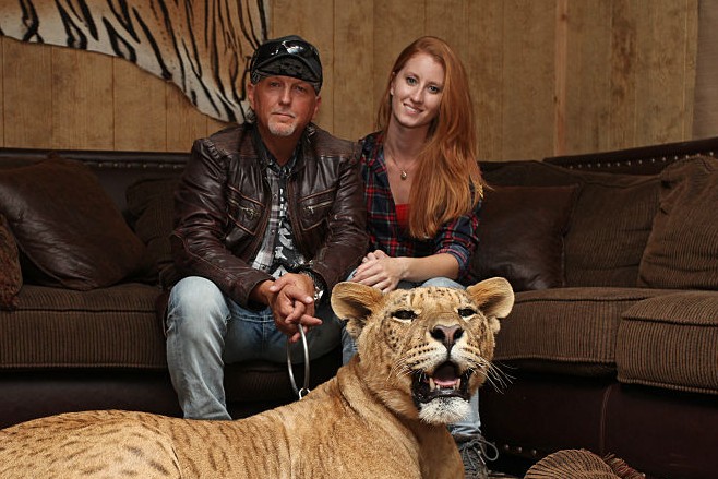 eff Lowe and Lauren Dropla with Faith the liliger at their home inside the Greater Wynnewood Exotic Animal Park on September 28, 2016 in Wynnewood, Oklahoma. ANIMAL lover Jeff Lowe provides care and shelter to more than 220 big cats - and they live in his back garden. 51-year-old Jeff owns the Greater Wynnewood Exotic Animal Park in Oklahoma, one of the largest private zoos in the world that rescues and protects over 500 wild animals, from tigers and lions to bears and crocodiles. Jeff, a multimillionaire, spends his days closely interacting with the most dangerous animals, walking them on leads inside his cabin house and laying in and around their enclosures he even takes his smaller tigers to the vets in his Ferrari. Lauren Dropla, Jeffs 25-year-old fiancé, offers a helping hand with looking after their exotic pets and maintaining the park on a daily basis. PHOTOGRAPH BY Ruaridh Connellan / Barcroft Images London-T:+44 207 033 1031 E:hello@barcroftmedia.com - New York-T:+1 212 796 2458 E:hello@barcroftusa.com - New Delhi-T:+91 11 4053 2429 E:hello@barcroftindia.com www.barcroftimages.com (Photo credit should read Ruaridh Connellan/BarcroftImages / Barcroft Media via Getty Images)
