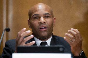 WASHINGTON - SEPTEMBER 9: US Surgeon General Jerome Adams appears before a Senate Health, Education, Labor, and Pensions Committee hearing to discuss vaccines and protecting public health during the coronavirus pandemic on September 9, 2020 in Washington DC. Dr. Anthony Fauci, director of the National Institute of Allergy and Infectious Diseases, recently said a vaccine likely won't be available until late this year at the soonest.