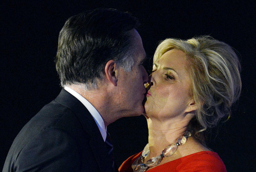 US Republican presidential candidate Mitt Romney kisses his wife Ann after conceding defeat to President Barack Obama on November 7, 2012 in Boston. Obama swept to re-election, forging history again by transcending a slow economic recovery and the high unemployment which haunted his first term to beat Romney. AFP PHOTO/Stan HONDA (Photo credit should read STAN HONDA/AFP via Getty Images)