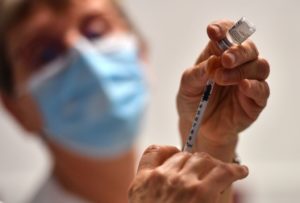 A nurse fills a syringe with the Pfizer-BioNtech coronavirus disease (Covid-19) vaccine on January 4, 2021.