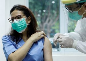 A medical worker receives inoculation of China's Sinovac COVID-19 vaccine at Cipto Mangunkusumo Hospital in downtown Jakarta, capital of Indonesia, Jan. 14, 2021.