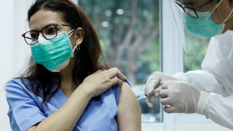 A medical worker receives inoculation of China's Sinovac COVID-19 vaccine at Cipto Mangunkusumo Hospital in downtown Jakarta, capital of Indonesia, Jan. 14, 2021.