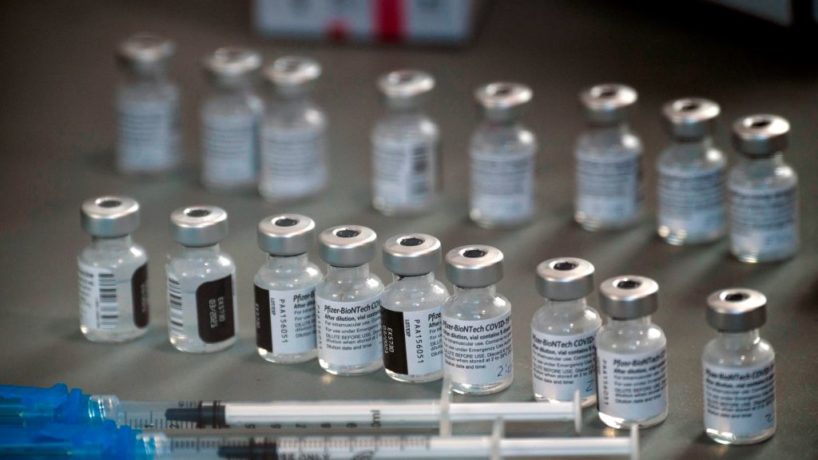 Syringes and vials of the Pfizer-BioNTech Covid-19 vaccine are prepared to be administered to front-line health care workers.
