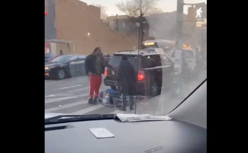 A man beats a bicyclist with a pipe.