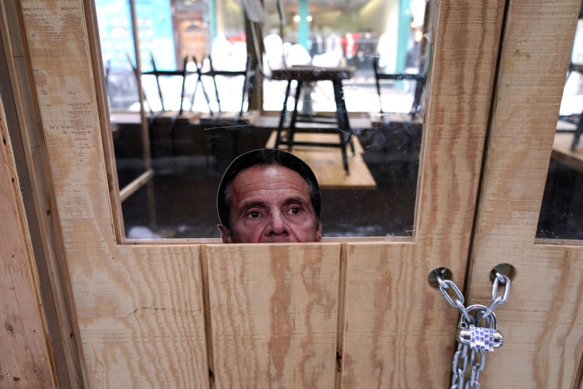 A picture of Governor of New York Andrew Cuomo is seen in a window of an outdoor dining area in Soho on February 11, 2021 in New York City. The pandemic continues to burden restaurants and bars as businesses struggle to thrive with evolving government restrictions and social distancing plans made harder by inclement weather. (Photo by John Lamparski/Getty Images)
