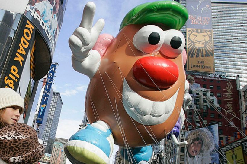 Children watch as a Mister Potato Head balloon makes its way down Broadway during the Macy's Thanksgiving Day Parade, on November 24, 2005 in New York City. (Photo by Stephen Chernin/Getty Images)