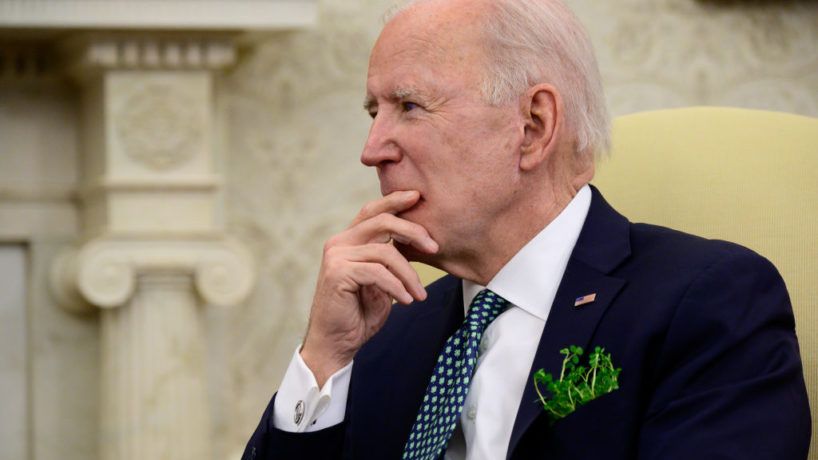 U.S. President Joe Biden listens during a virtual meeting with Irish Prime Minister (Taoiseach) Micheal Martin in the Oval Office of the White House on March 17, 2021 in Washington, DC. Two of Biden's great-great-grandparents emigrated from Ireland. (Photo by Erin Scott-Pool/Getty Images)
