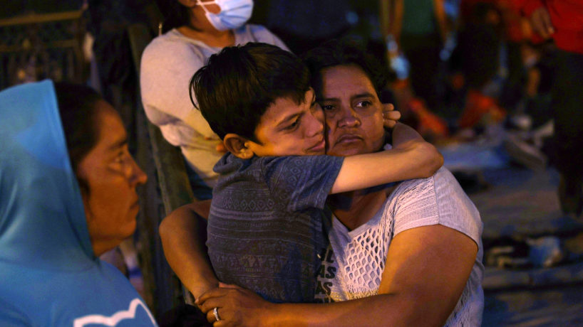 REYNOSA, MEXICO - MARCH 25: Lidia, originally from Guatemala, hugs her son Jefferson as they camp in the Plaza las Americas after being deported after crossing illegally into the United States on March 25, 2021 in Reynosa, Mexico. Lidia says she had been waiting in the park for eight days hoping for a chance to seek asylum in the United States.