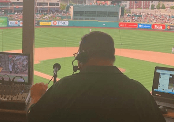 Mike Maahs broadcasting from the press box of Parkview Field in Fort Wayne