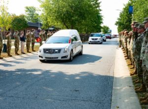 A hearse carries Sanchez's body to Logansport