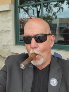 Guy Relford smokes a cigar during the bomb threat