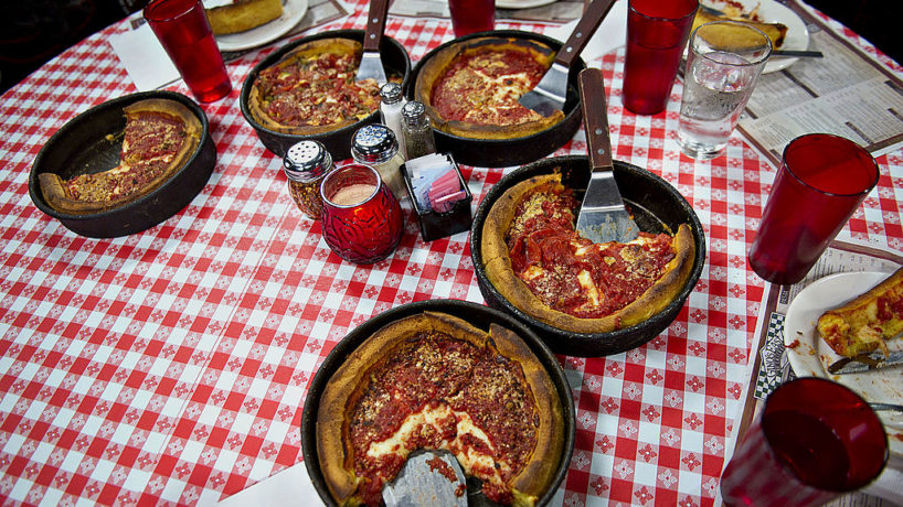 Deep dish pizza sits on a table at Gino's East restaurant in Chicago, Illinois, U.S., on Wednesday, April 18, 2012.