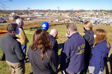 Rescue workers face the debris left behind by the Mayfield, Kentucky tornado